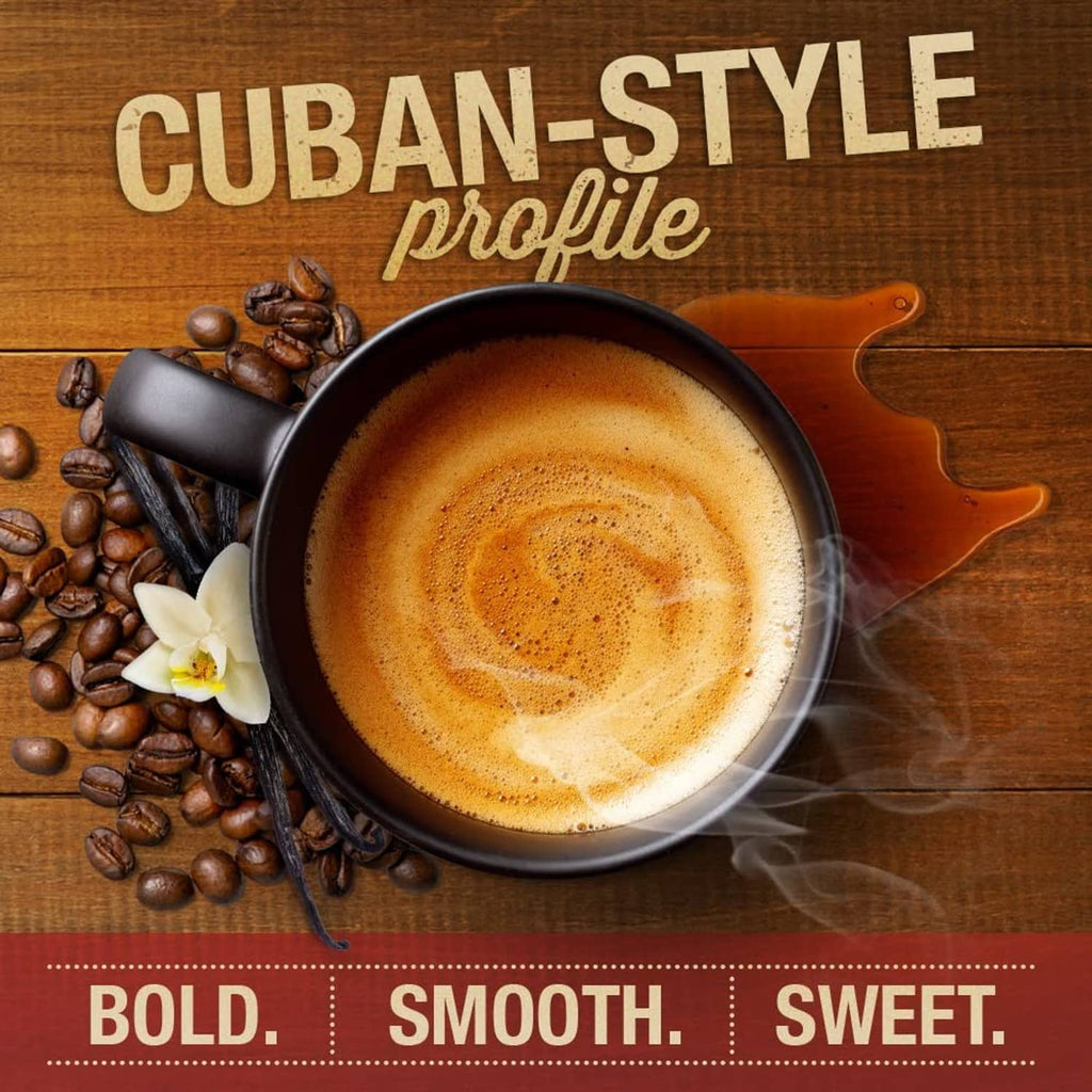 Cuban-style coffee cup with crema, surrounded by coffee beans and vanilla pod garnish
