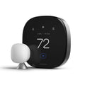 Black smart thermostat with large touchscreen displaying 72° and icons