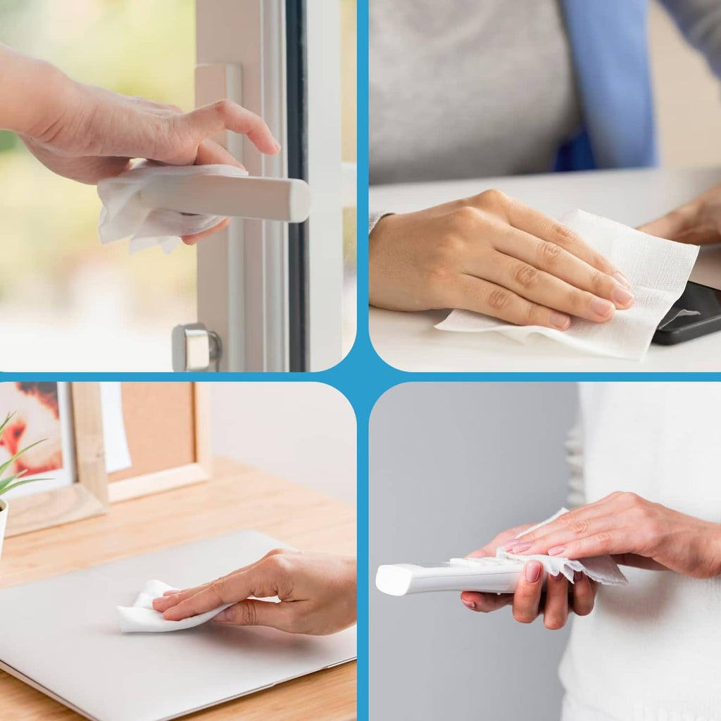 White multi-fold paper towel being pulled by hand for cleaning