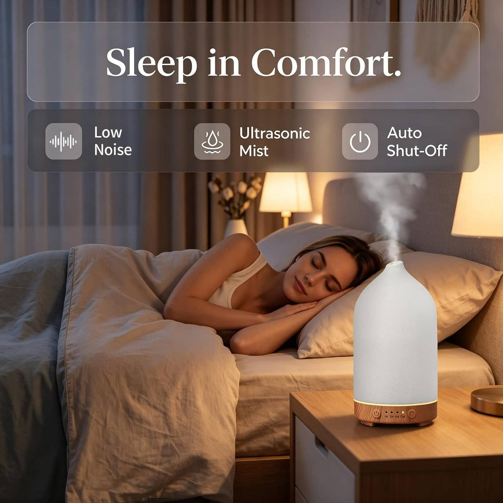 Ceramic essential oil diffuser on nightstand, mist rising from matte white top