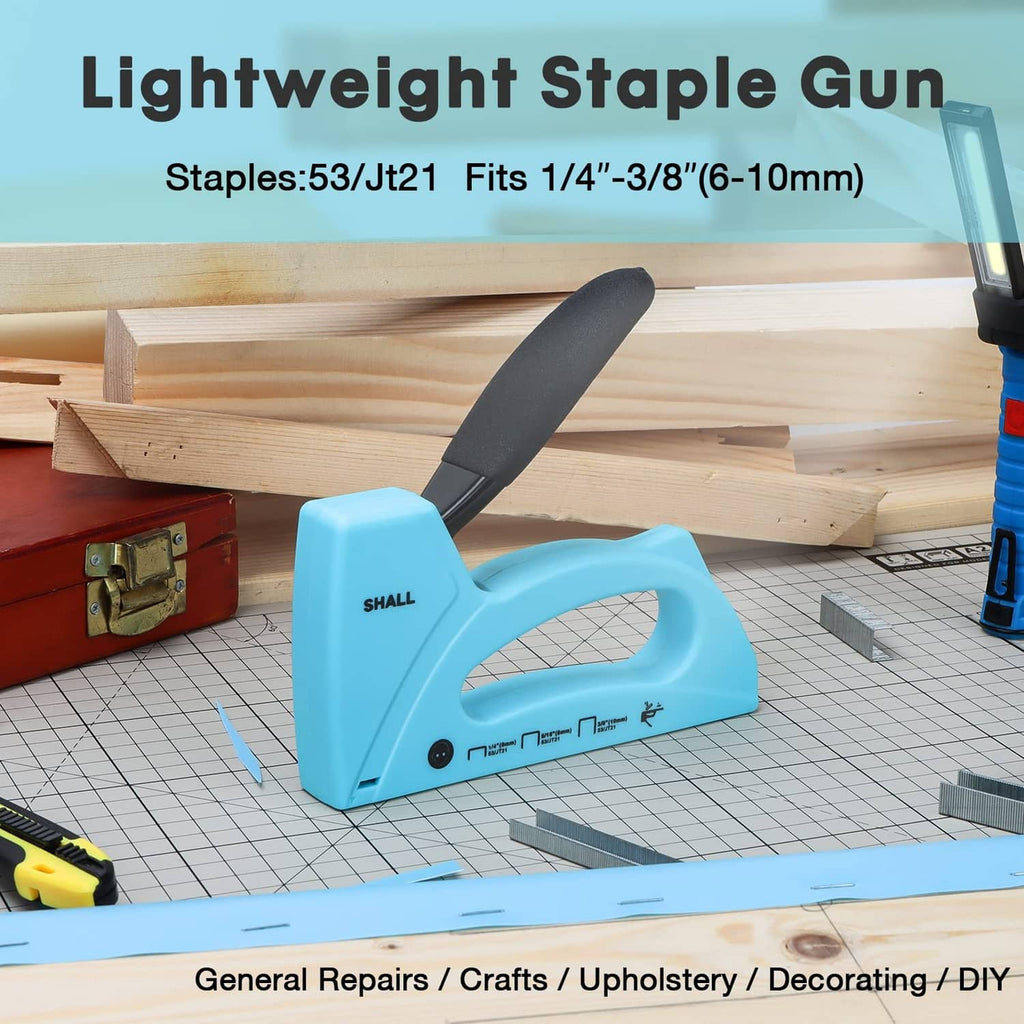 Light blue staple gun with black handle aimed at wood board