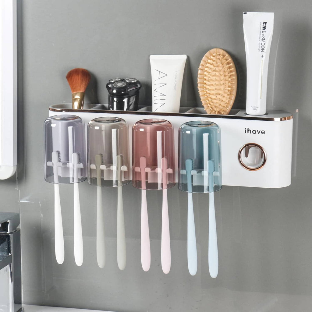 Bathroom toothbrush holder with four clear color cups and hanging toothbrushes