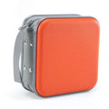 Orange hard plastic DVD/CD case with grey carrying strap and zipper edges.