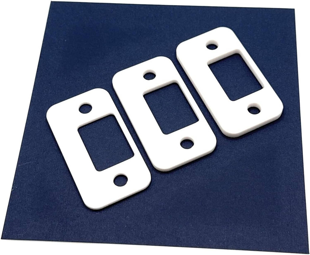 Set of 3 white metal door strike shims, each with mounting holes and cutout slot.