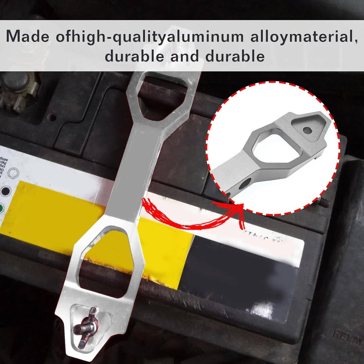 Silver aluminum battery tie-down bracket mounted on a car battery tray with hardware