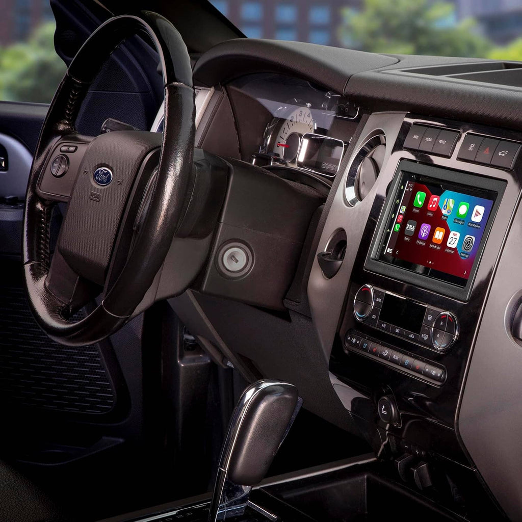 Double DIN radio dash kit installed on center console, showing touchscreen and climate controls