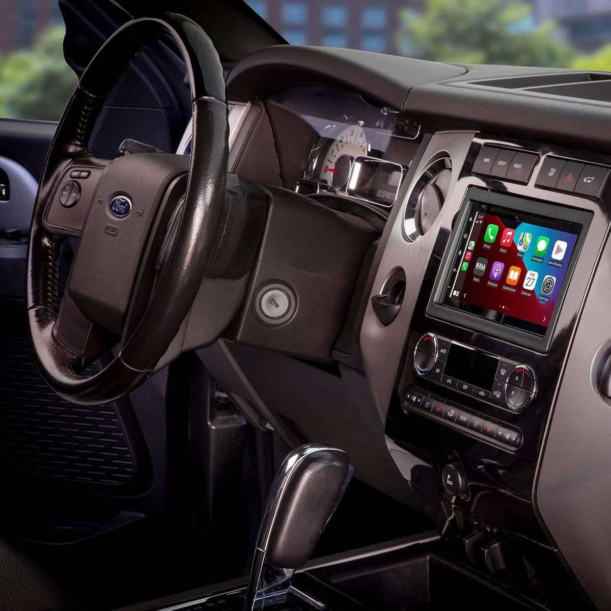 Double DIN radio dash kit installed on center console, showing touchscreen and climate controls