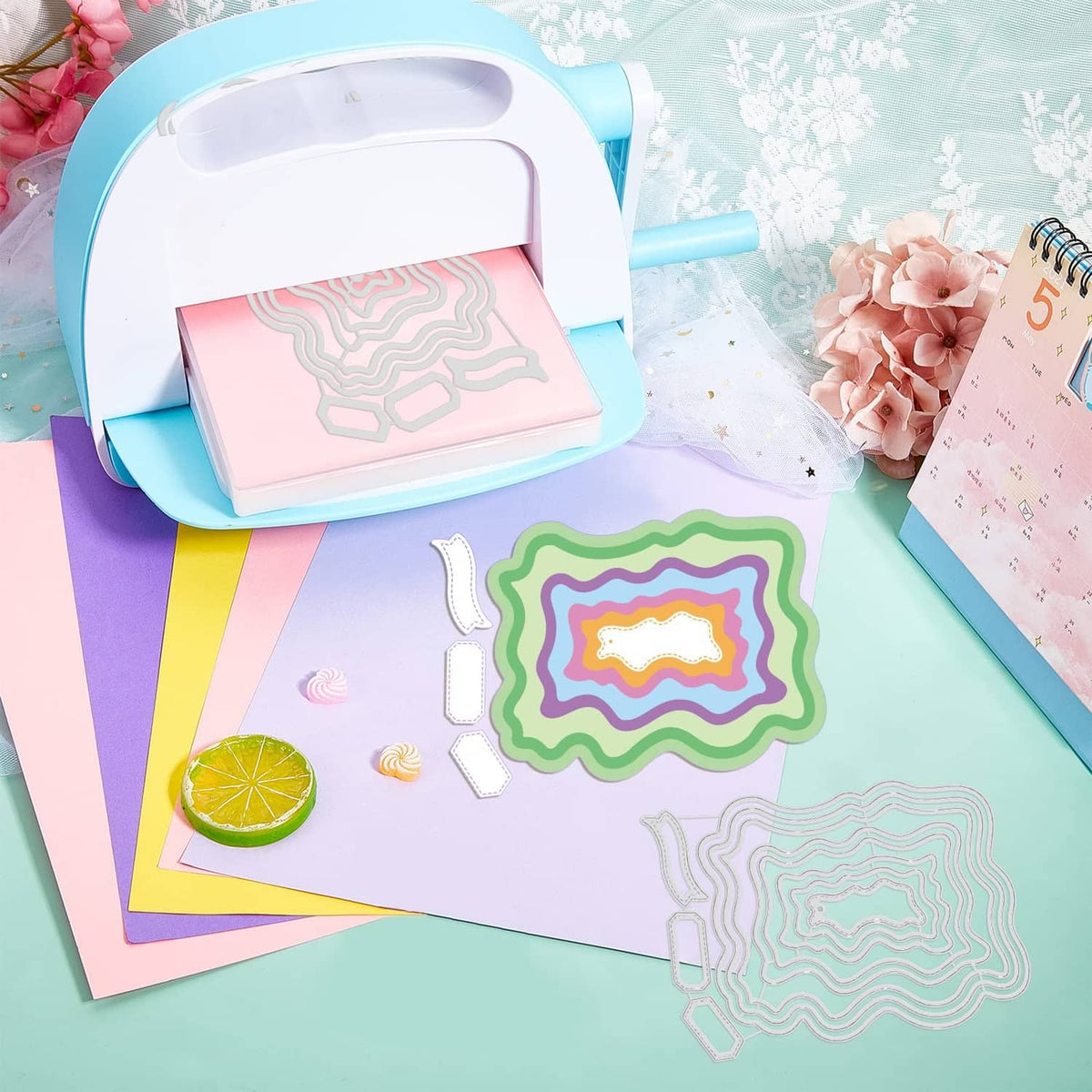 Wavy frame cutting dies and die-cut layers on pastel crafting paper