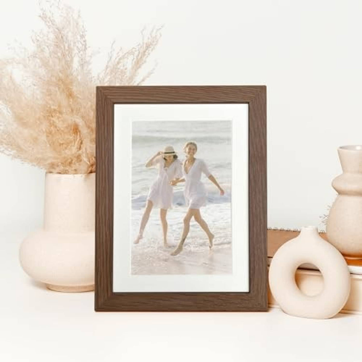 Walnut oak 5x7 photo frame with white mat, featuring a beach couple photo