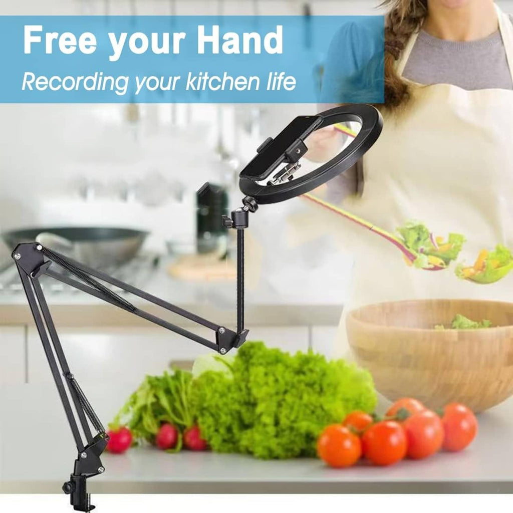 Black overhead tripod mount arm with phone clamp above food on counter