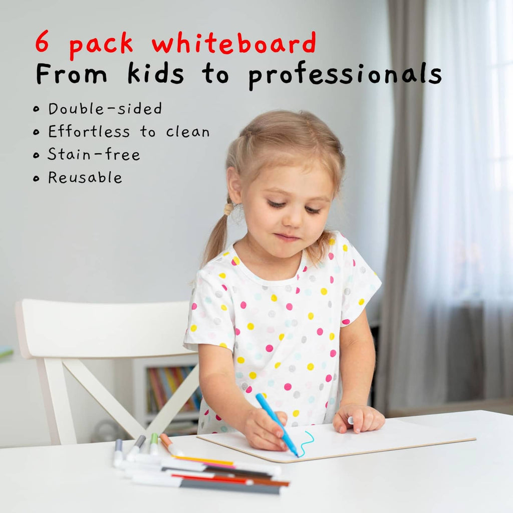 White dry-erase lapboard with writing in blue marker, held by a child