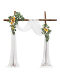 Artificial wedding arch floral kit with white sheer drapes and yellow sunflowers