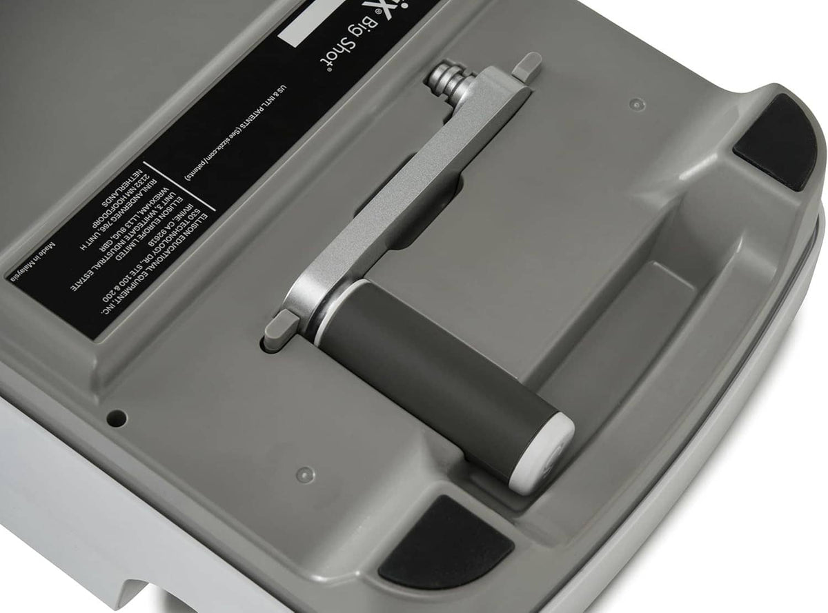 Close-up of Sizzix Big Shot metal plate and gray feed roller