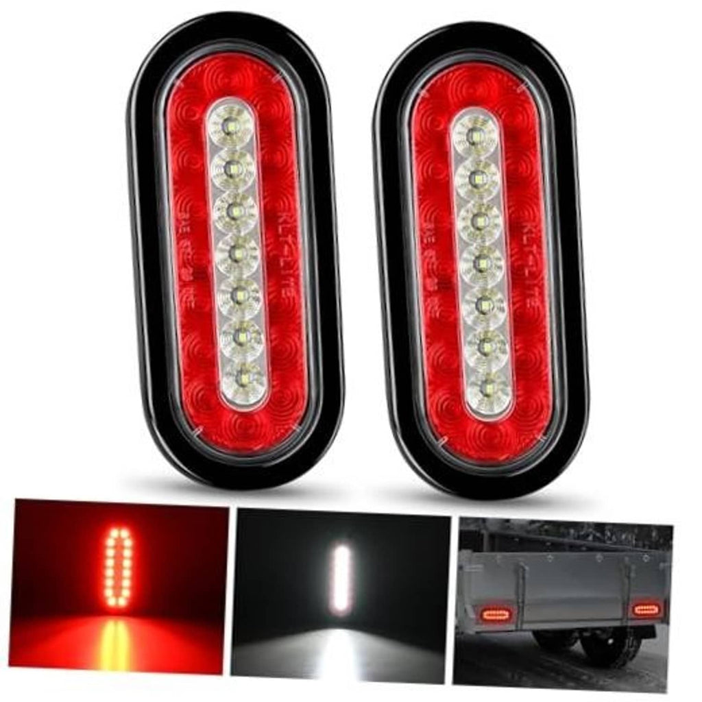 Pair of oval red LED trailer tail lights with clear center strip and black housing