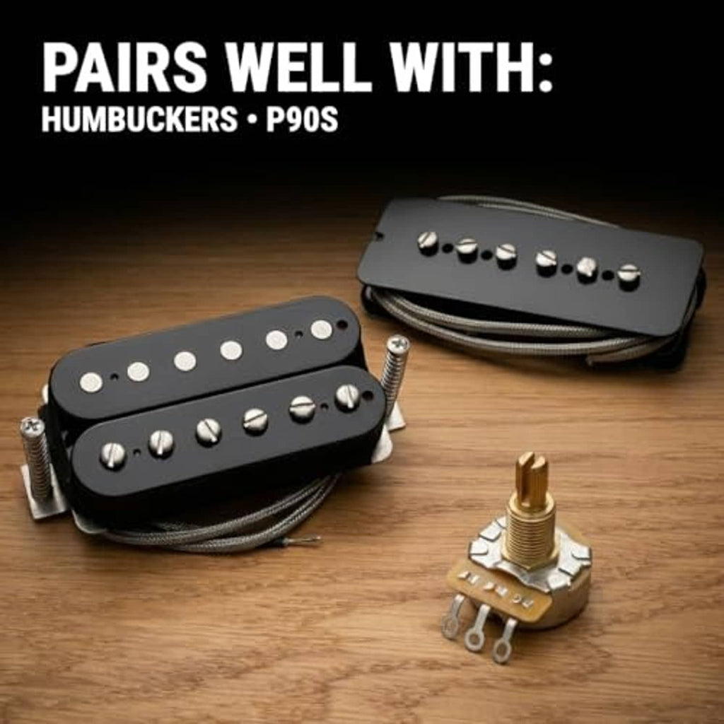 Guitar potentiometer with pickup leads and mounting part on a wood surface