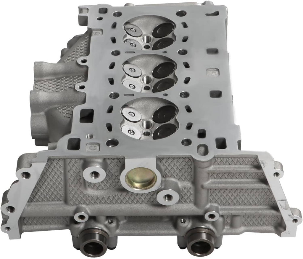 Engine cylinder head with valve chamber and oil passage opening, silver metal