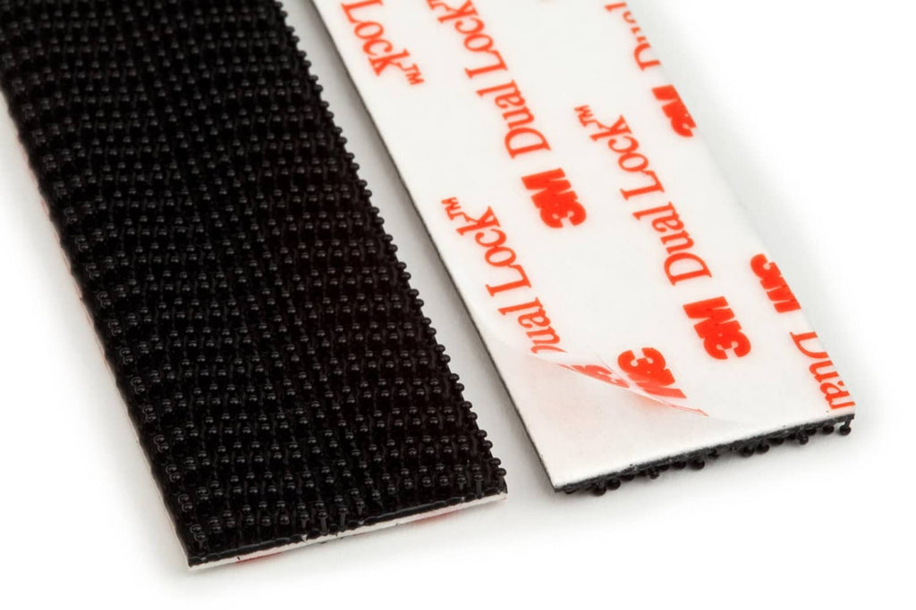 Black interlocking fastener strip with textured hooks and white backing card