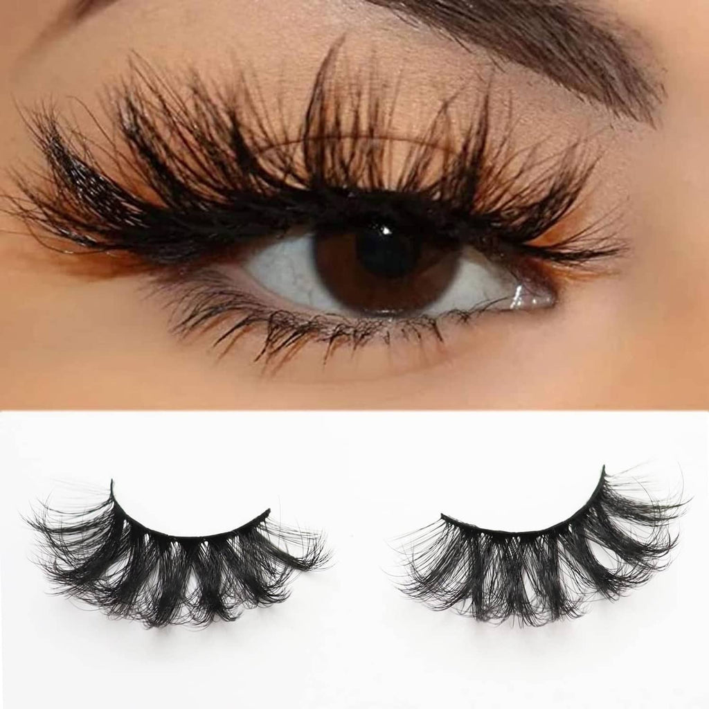 False eyelashes worn by a model, thick black lashes across the upper eyelid.
