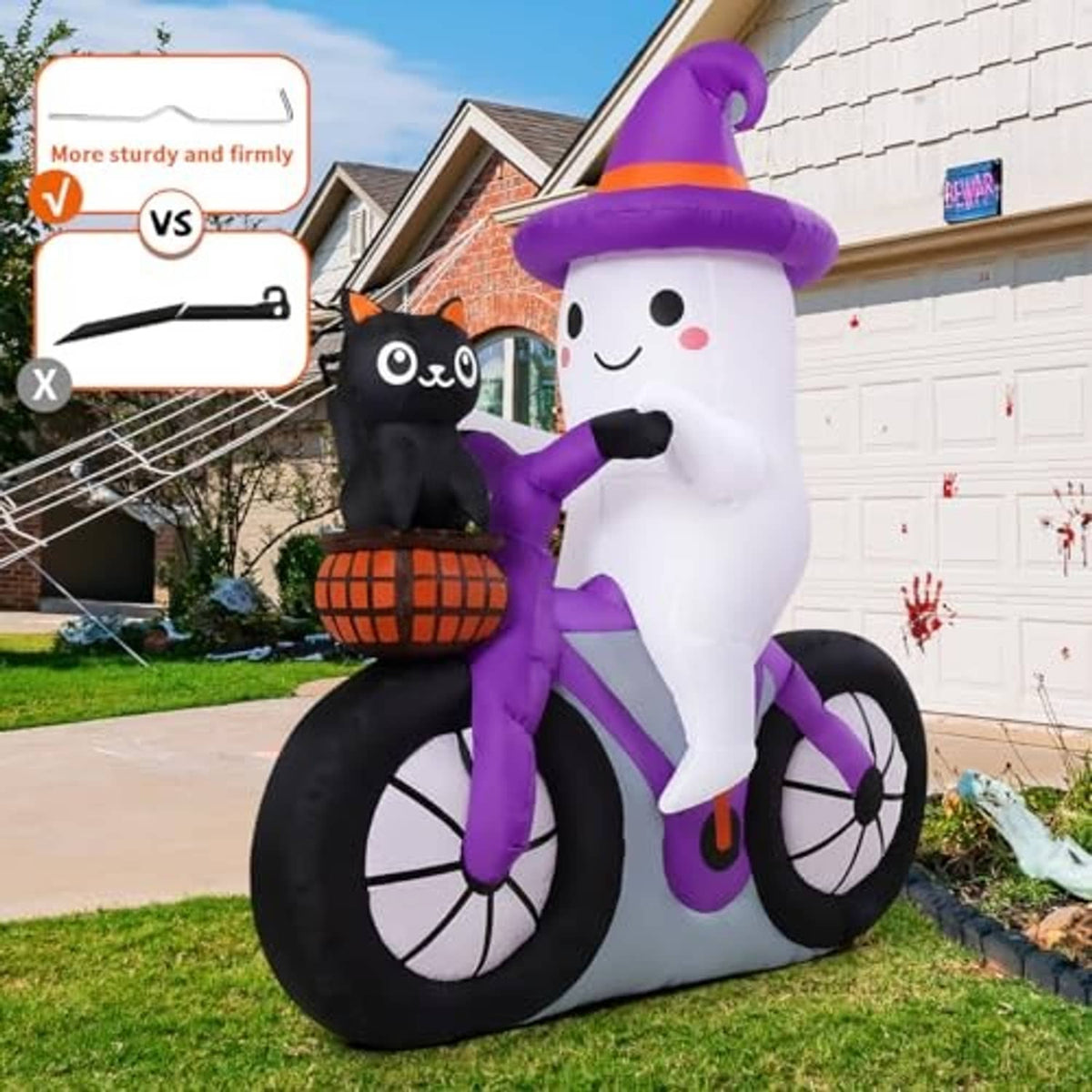 Inflatable ghost bike decoration with purple hat, black wheels, and cat on pumpkin basket