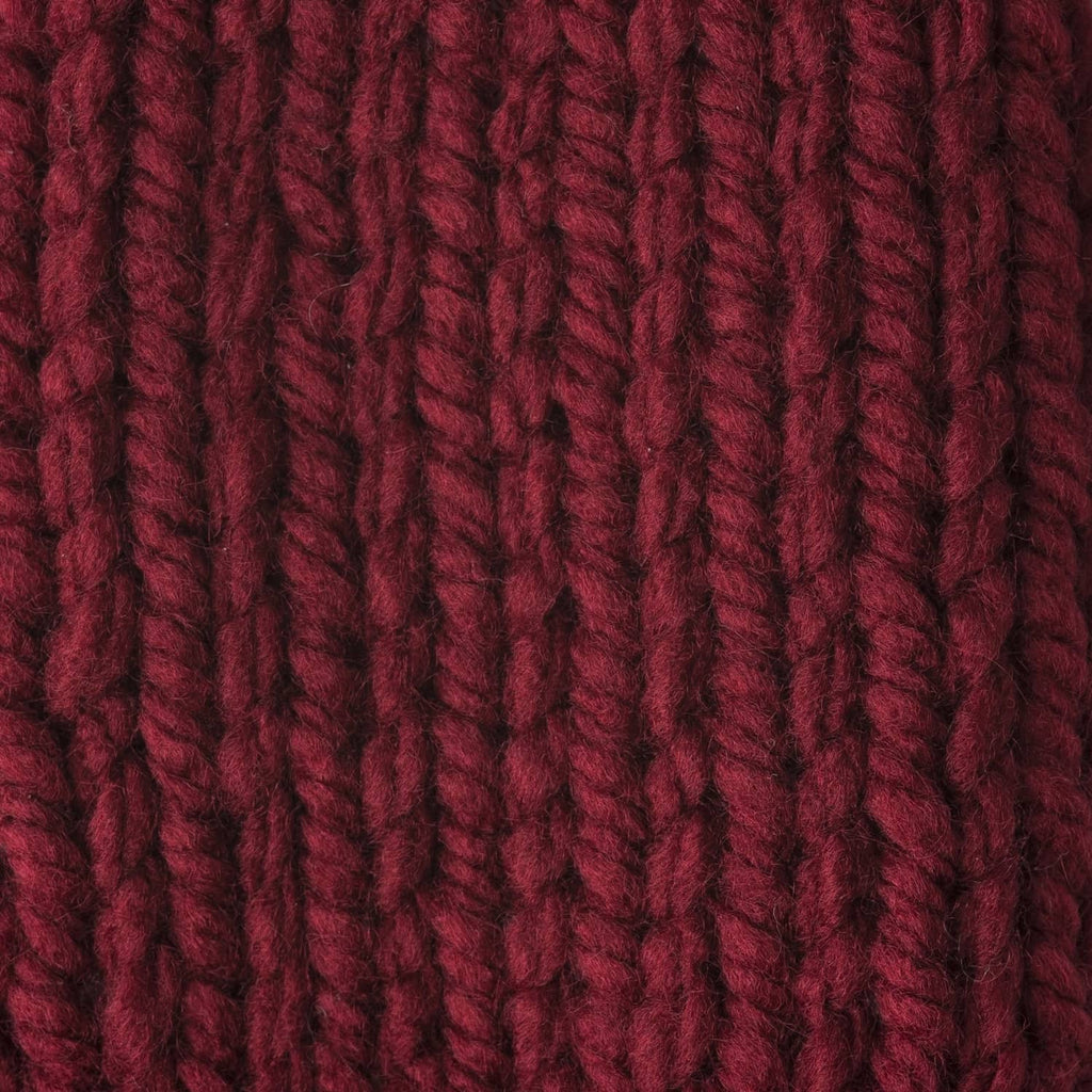 Close-up of maroon chunky yarn strands with vertical ribbed texture