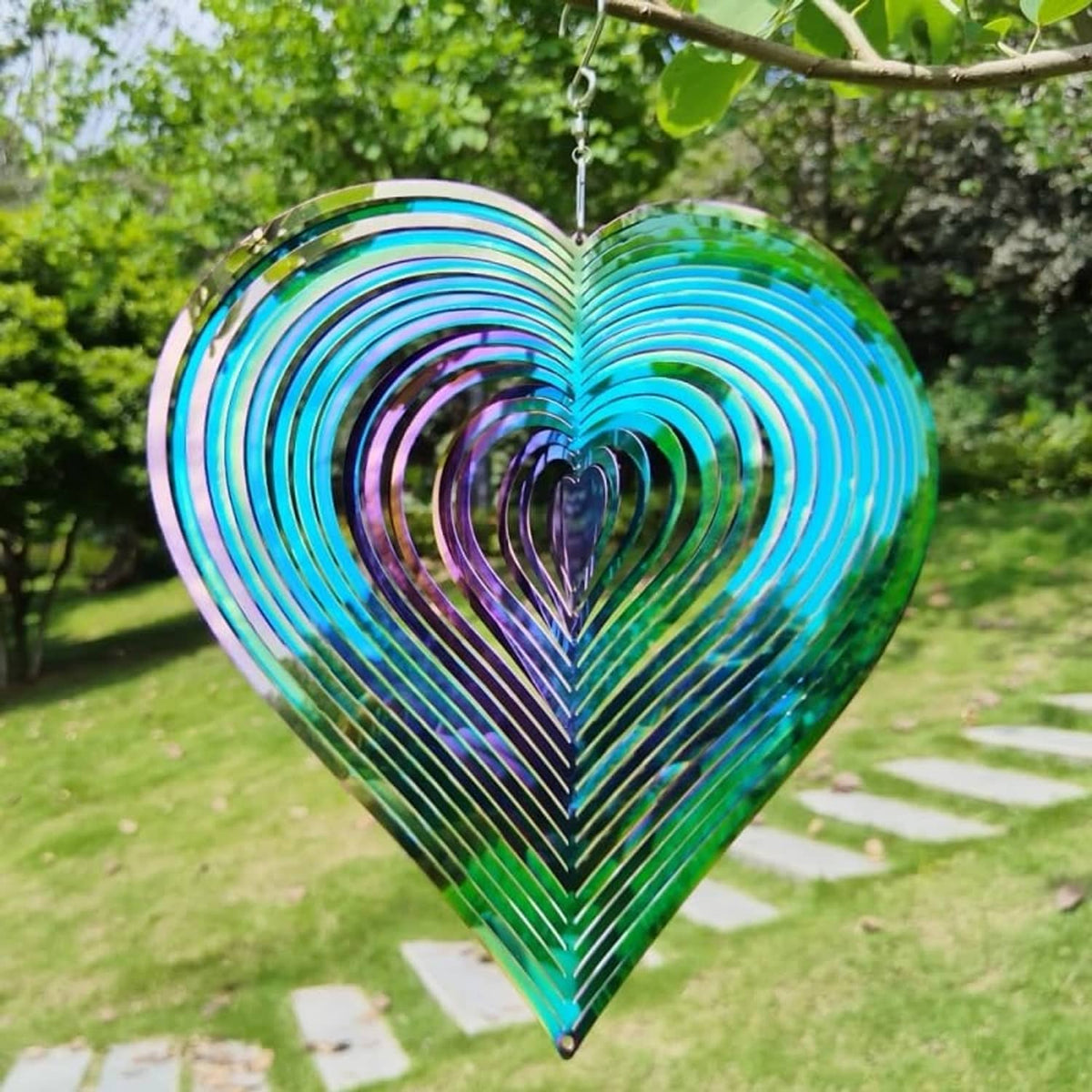 Heart yard spinner wind chime with blue outer rings and glossy multicolor inner stripes