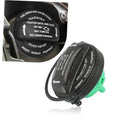 Black fuel filler cap with green seal insert and attached rubber tether cord