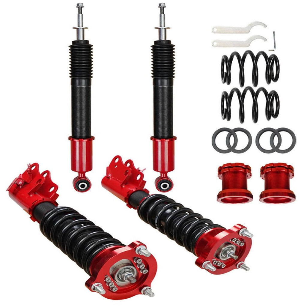 Pair of black coilover struts with red bodies and included spring set components