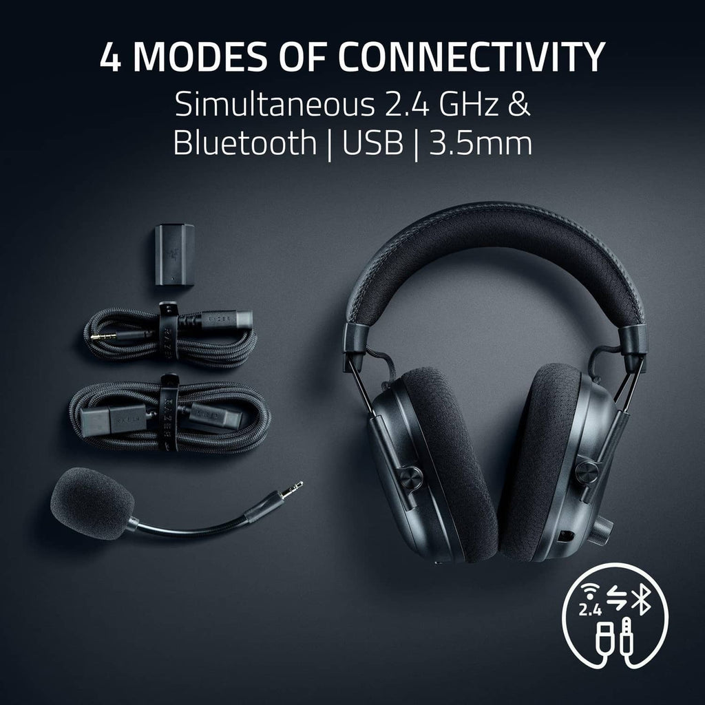 Black wireless gaming headset with boom mic and included cables and adapters.