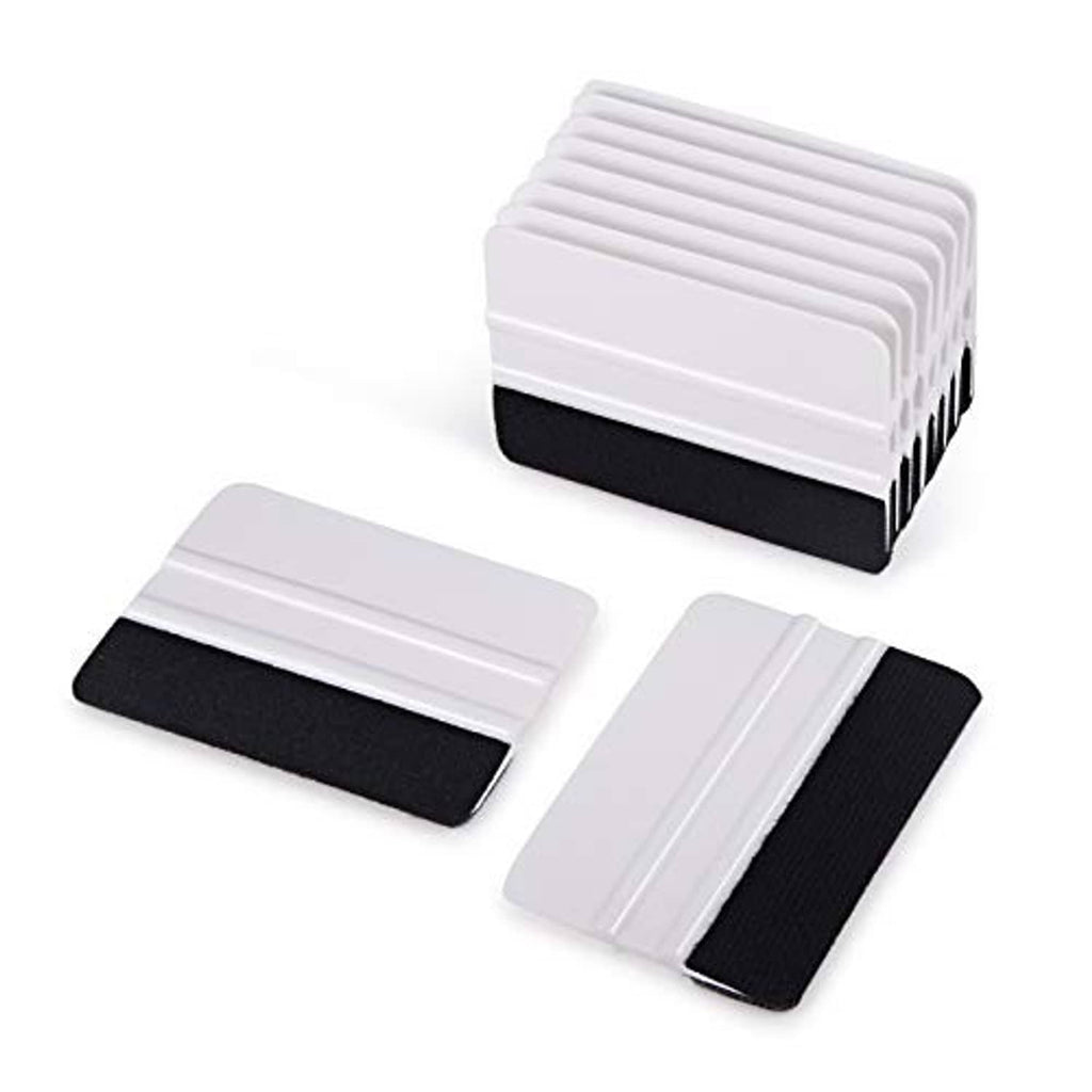 Multiple vinyl squeegees stacked and laid out, white handles with black felt edges