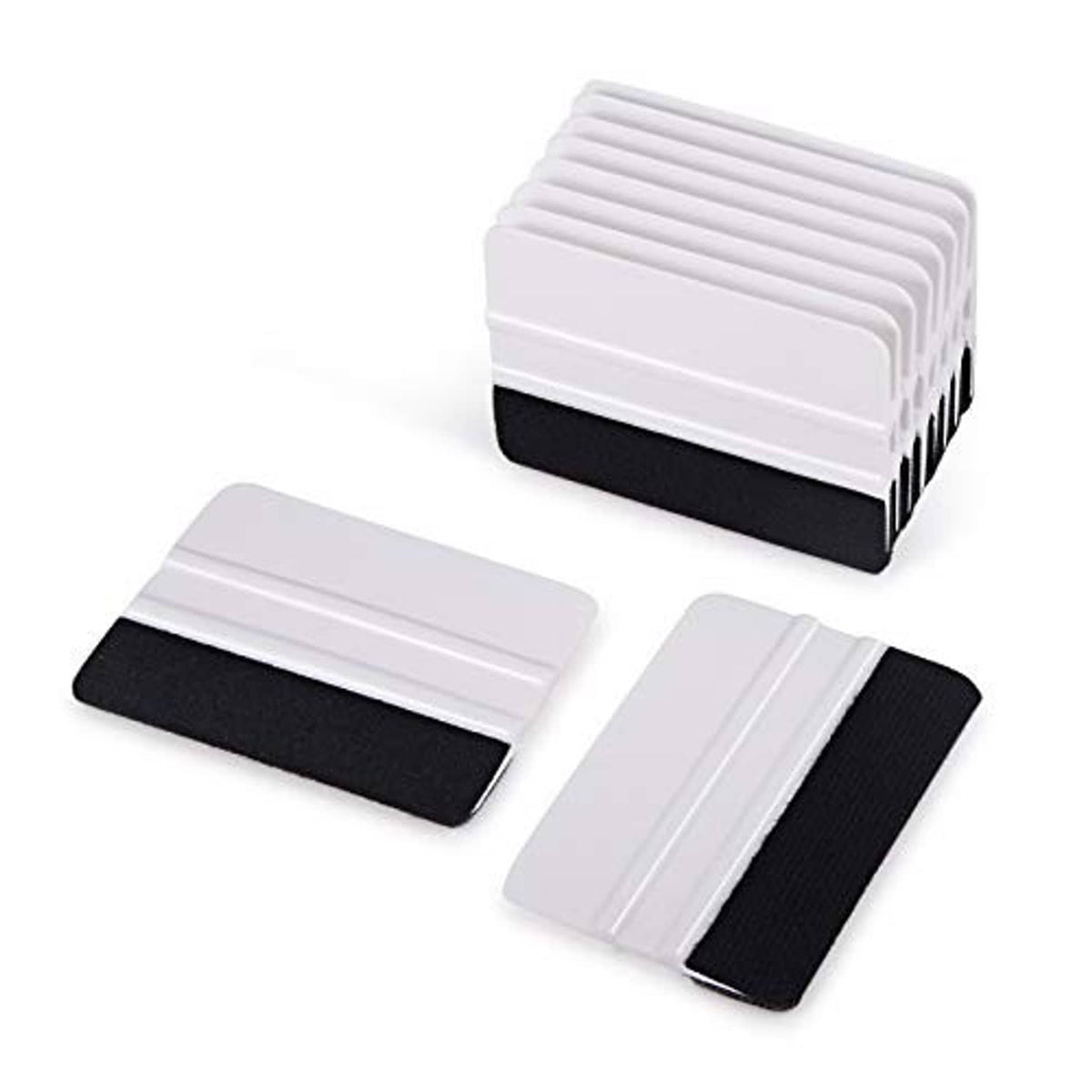 Multiple vinyl squeegees stacked and laid out, white handles with black felt edges