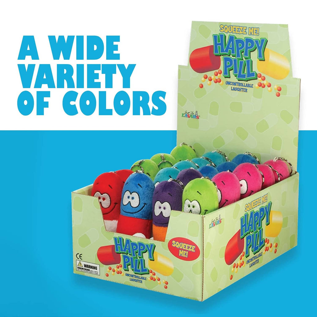 Happy Pill plush assortment in mixed colors displayed in a cardboard box