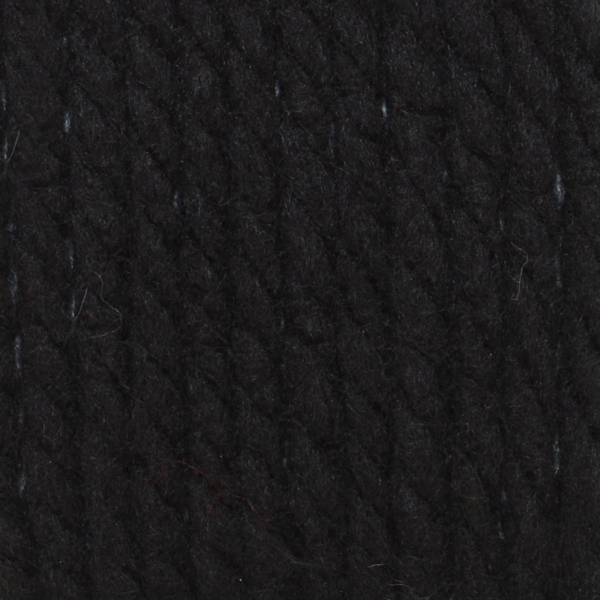 Dark black chunky yarn texture close-up