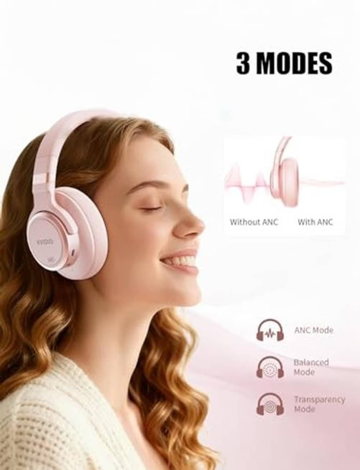Pink over-ear wireless headphones worn by a person, showing earcups