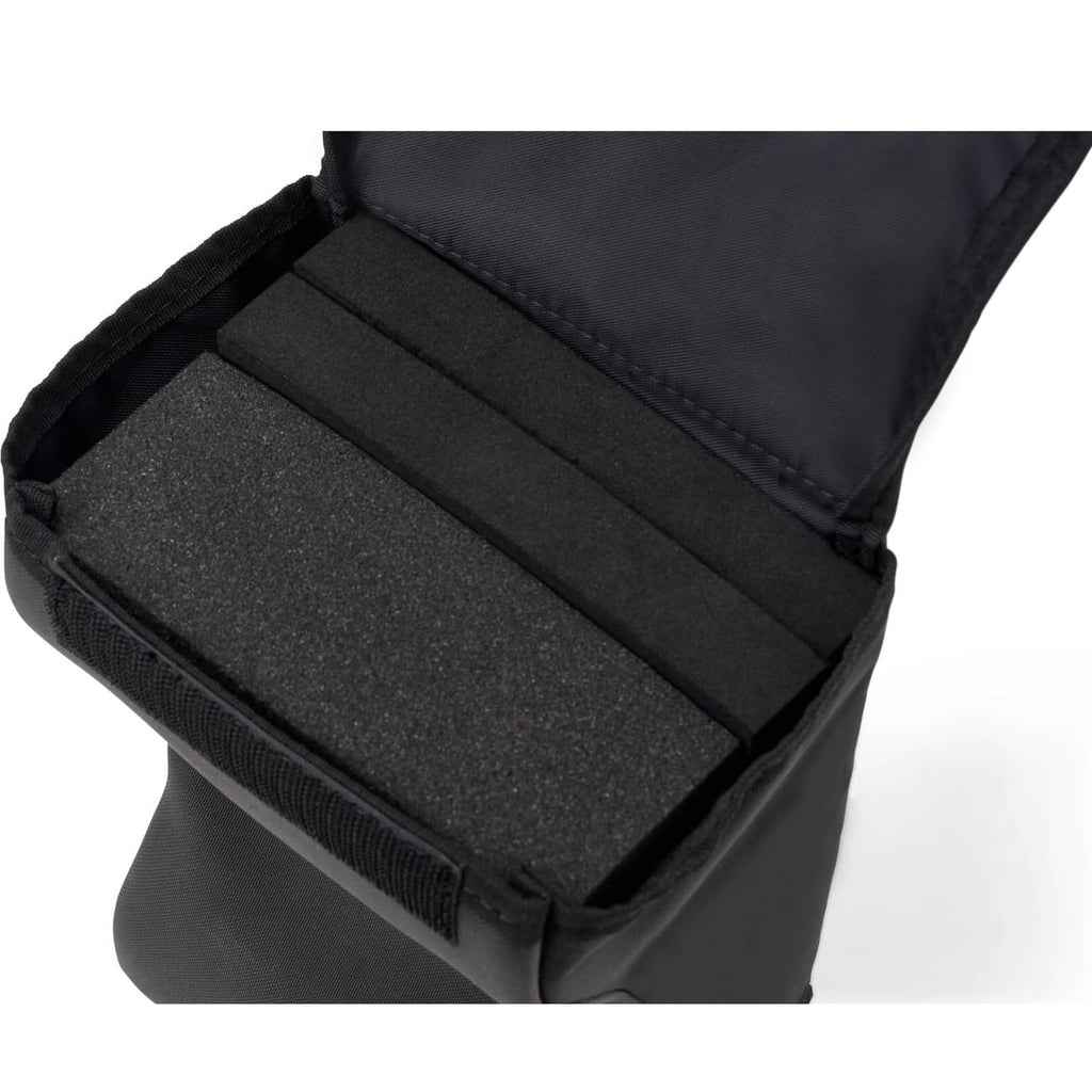 Black lap pad open view showing foam insert and fabric-lined compartments