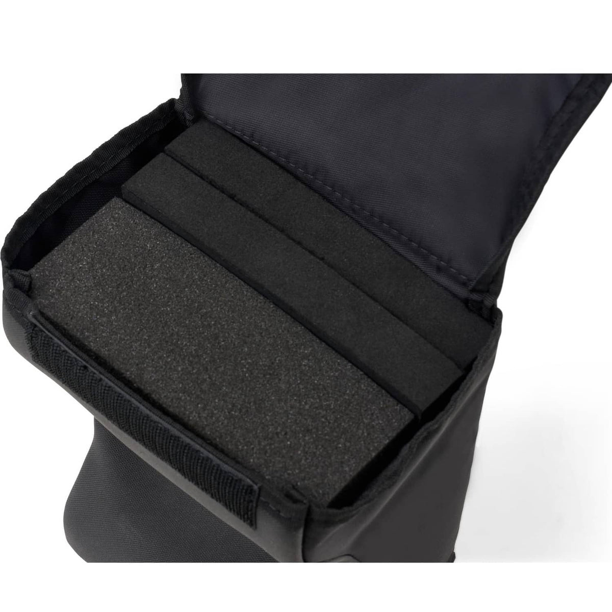Black lap pad open view showing foam insert and fabric-lined compartments
