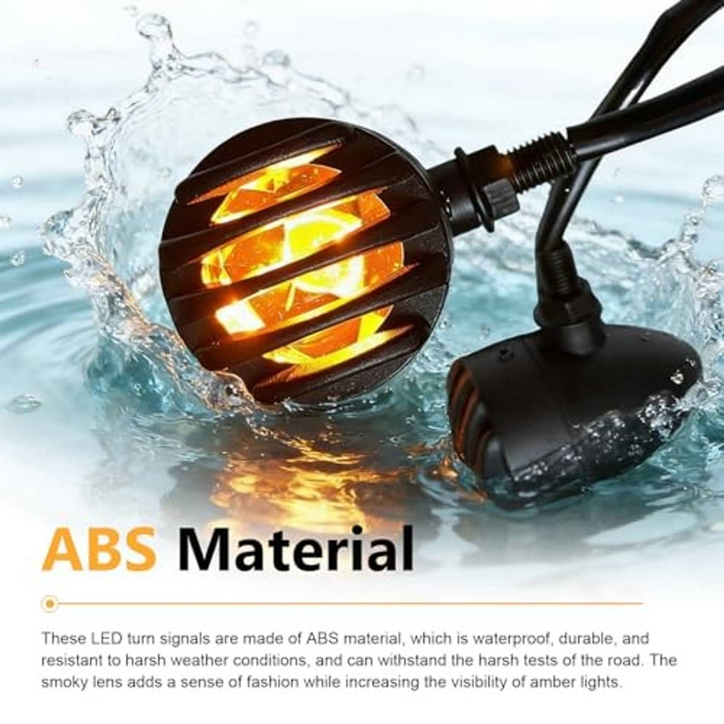 Water-splash scene: black motorcycle LED turn signal with amber horizontal light bars