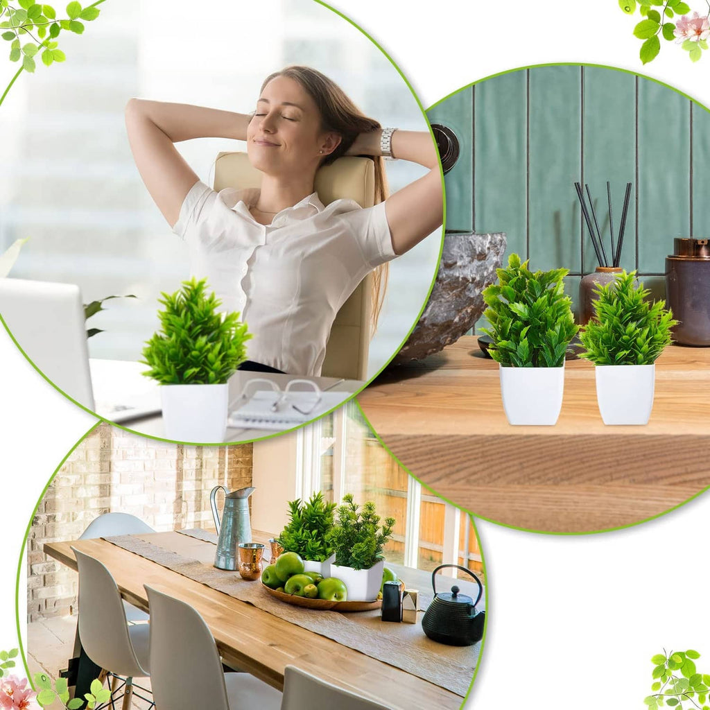 Small artificial plants in white pots, green leaves with purple flower accents