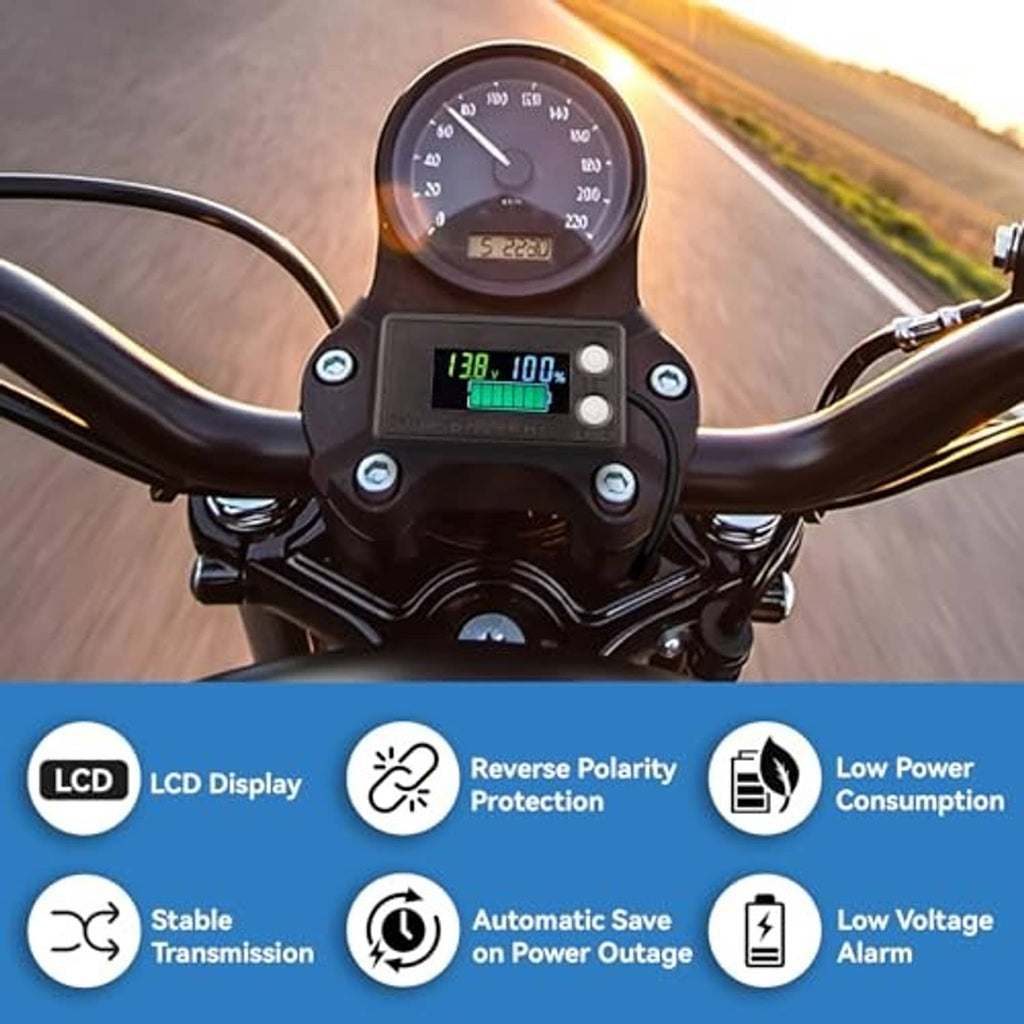 Handlebar-mounted battery monitor with LCD showing 13.8V and 100%