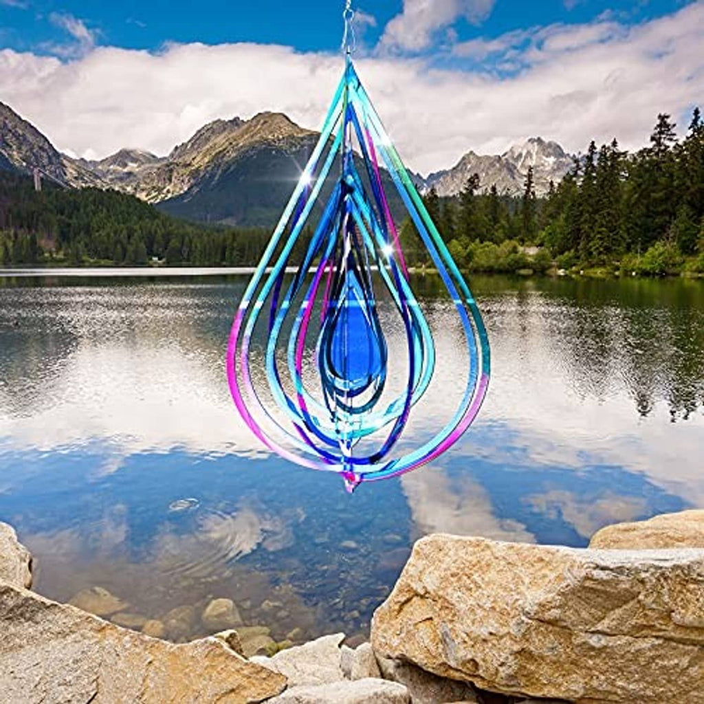 Colorful teardrop wind spinner with spiral stainless-steel coils hanging outdoors