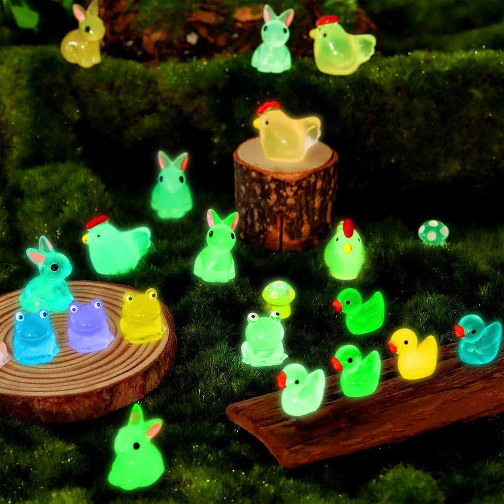 Glowing mini duck figurines on wooden logs over green grass, multicolor