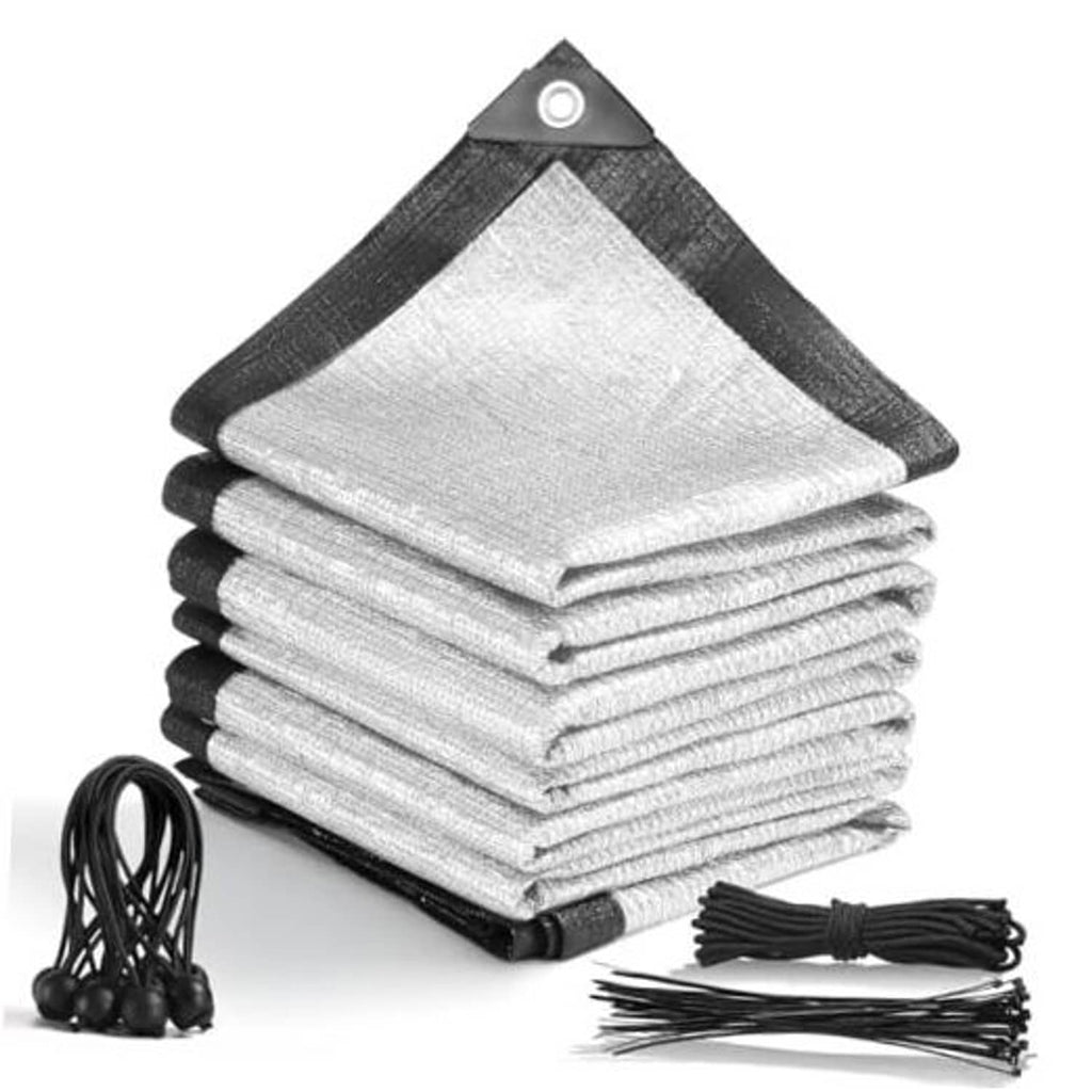 Stacked silver shade cloth sheets with dark border, corner grommets, and tie ropes