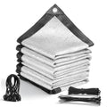 Stacked silver shade cloth sheets with dark border, corner grommets, and tie ropes