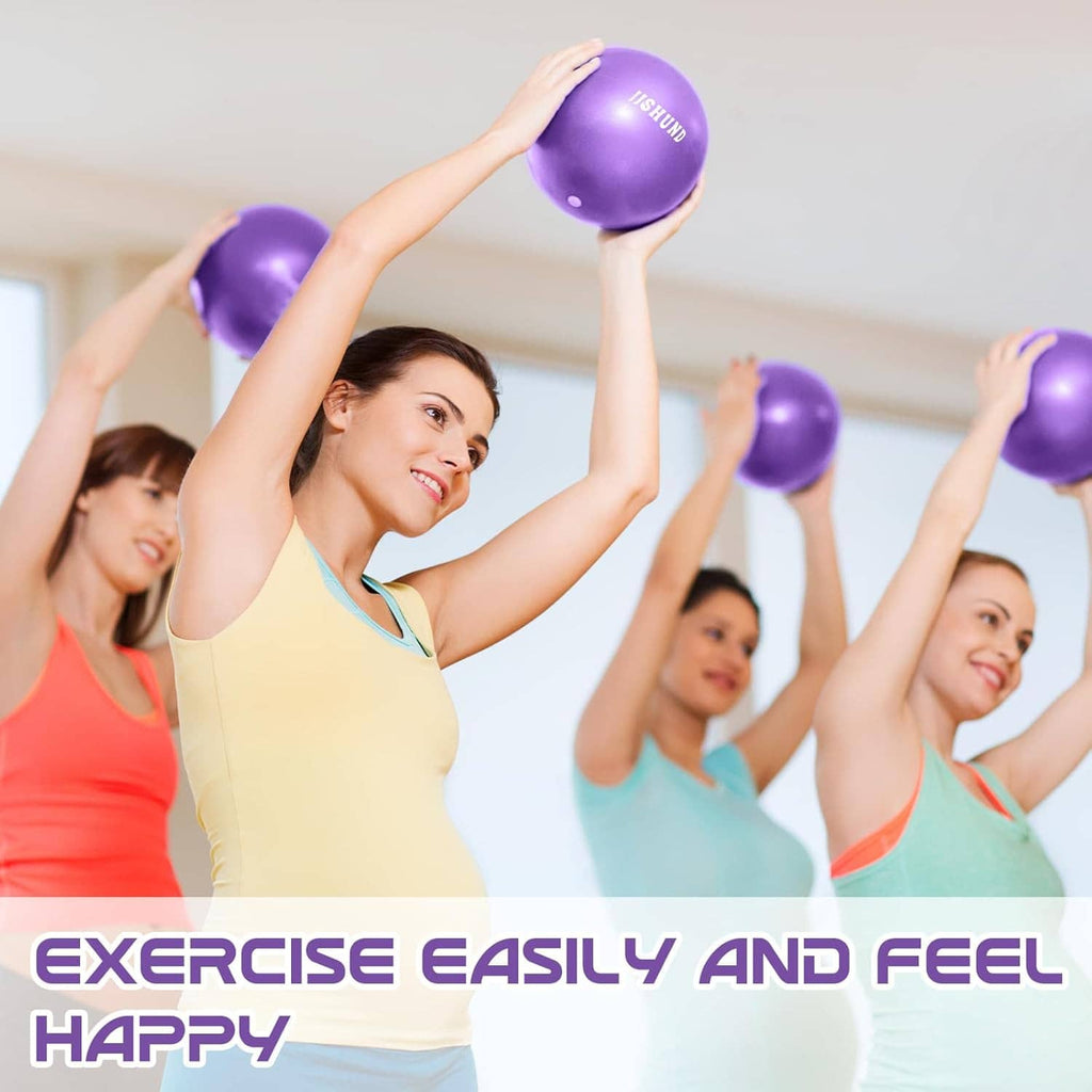 Purple mini exercise balls held overhead by a group during workout