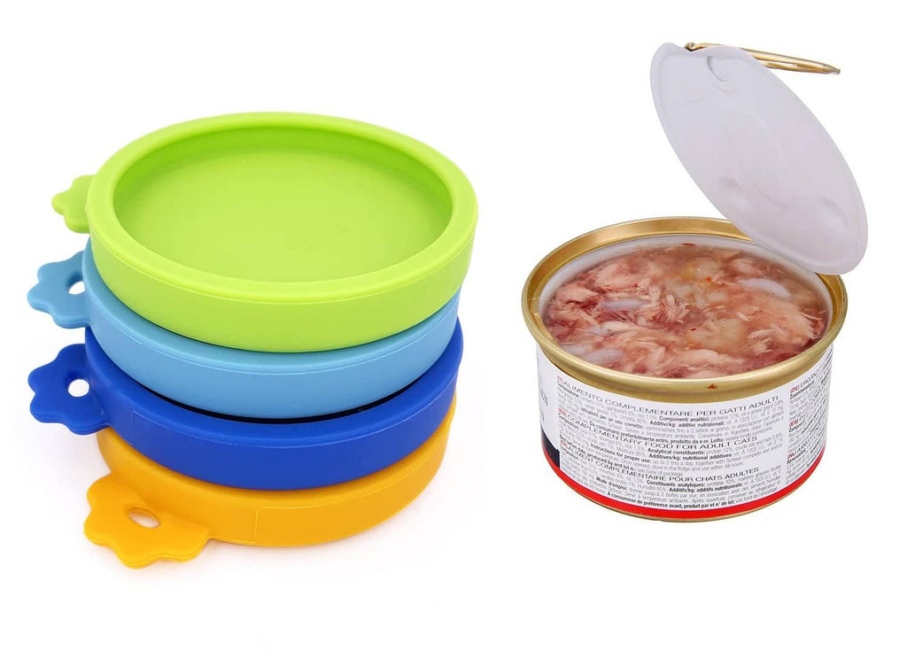 Three silicone pet food can lids in green, blue, and orange with a covered can