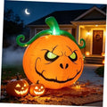 Lighted inflatable jack-o'-lantern pumpkin with green curly stem and smiling face