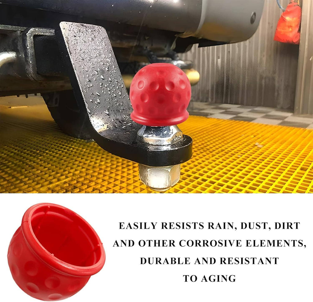 Red rubber towball cover protecting a trailer hitch ball on a metal tow bar