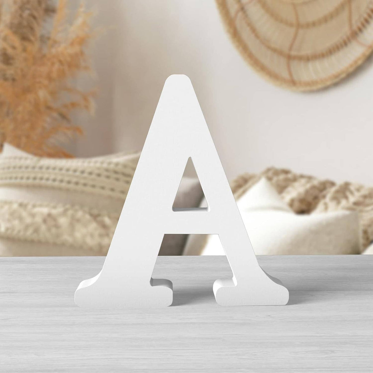 White unfinished wooden letter A for DIY crafts, freestanding