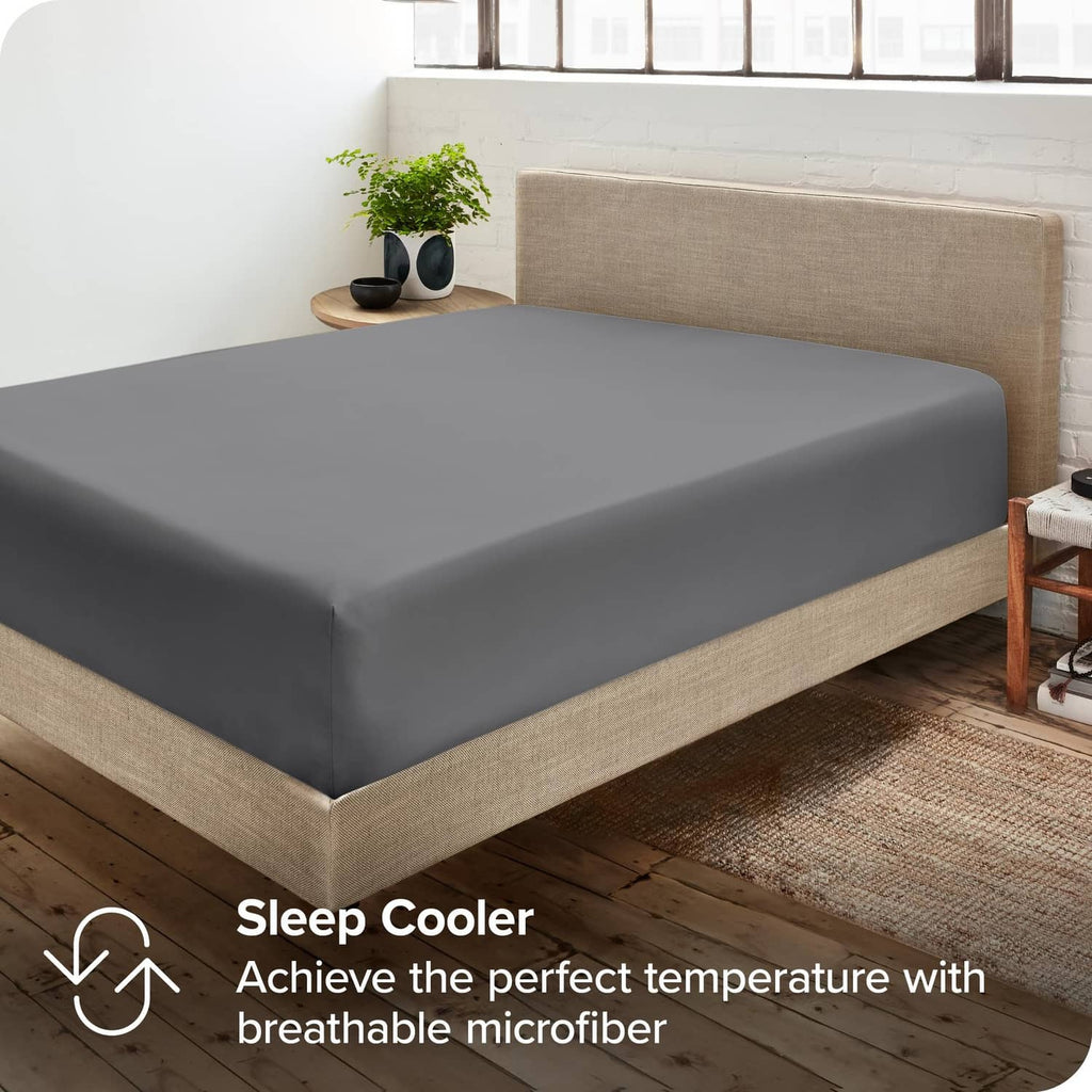 Grey queen fitted sheet on bed mattress, breathable microfiber cover