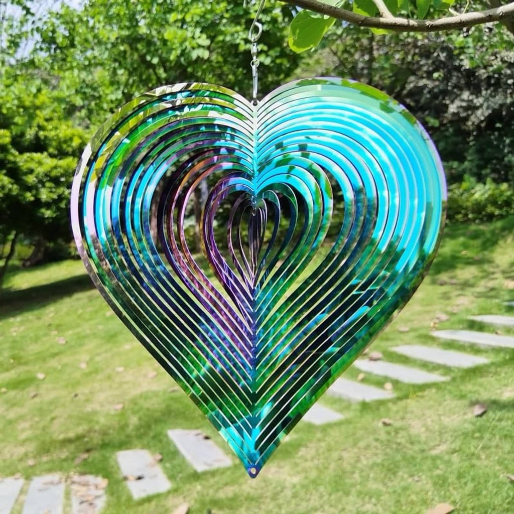 Heart-shaped metal wind spinner with green outer edge and rainbow reflective spiral rings