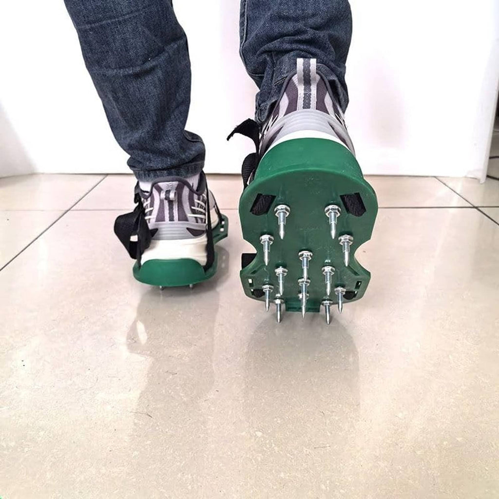 Pair of green spiked shoes with black straps and metal nail studs